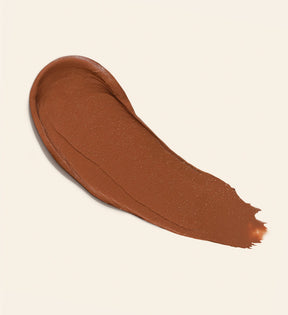 Soft Tan Bronzer romige swatch in de tint Dark voor een opbouwbare textuur en natuurlijke zongebruinde gloed