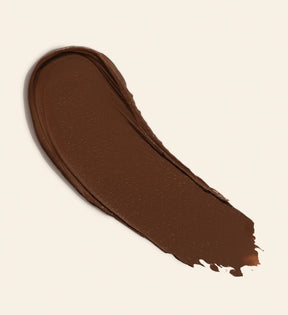 Soft Tan Bronzer textuur swatch in de tint Deep voor een romige, natuurlijke zomerse gloed.